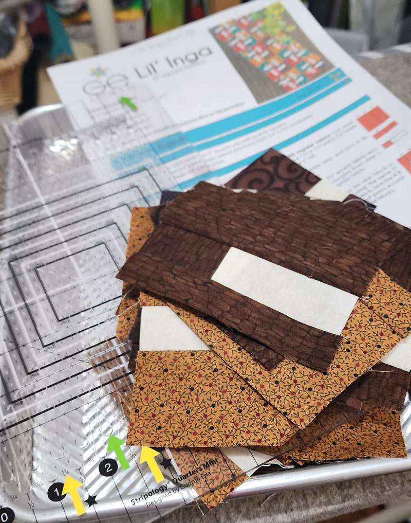Table runner blocks in progress with the pattern sheet and a Stripology ruler